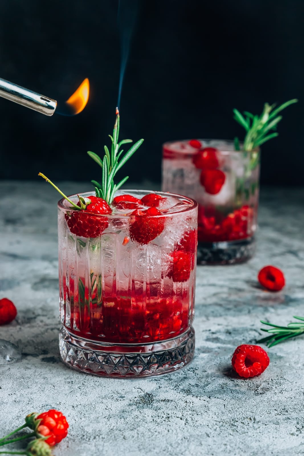 cocktail-with-raspberries-and-rosemary-2023-11-27-04-57-23-utc